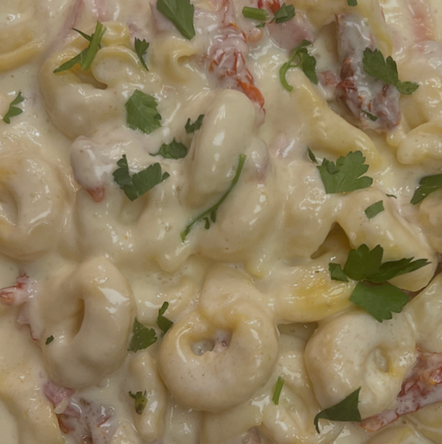 Cheese Tortellini with Prosciutto, Sun Dried Tomatoes and Alfredo.